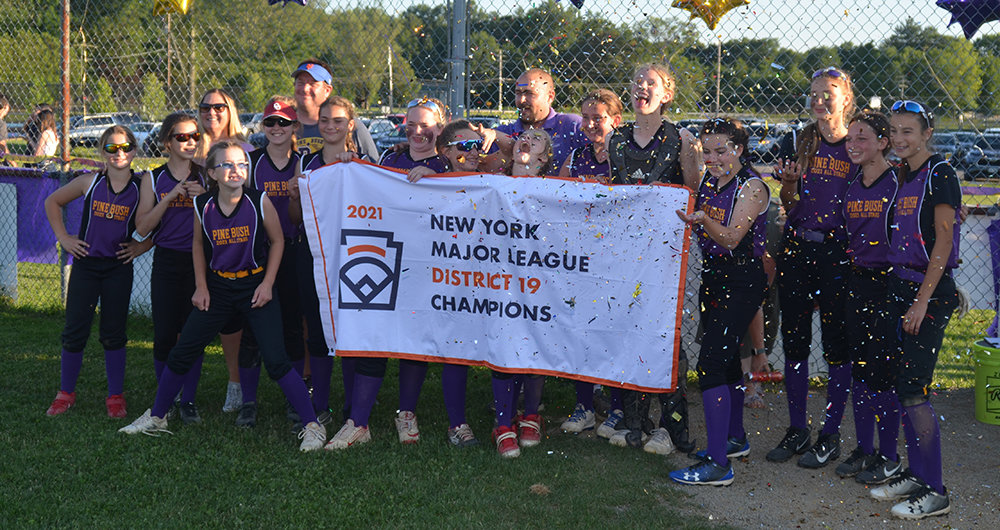 Pine Bush-Monticello is shown with the District 19 championship banner after beating Warwick-Greenwood Lake, 2-0, on Wednesday at the Pine Bush Little League field.